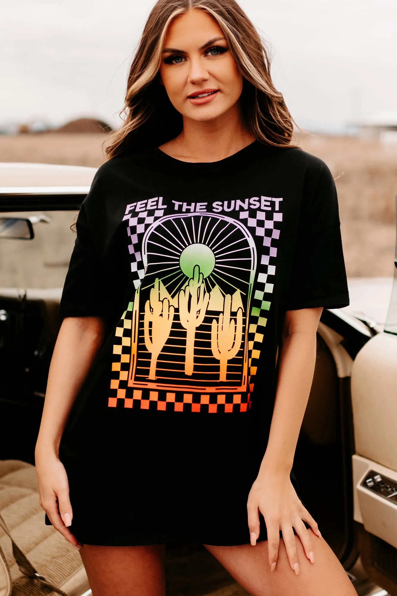 "Feel The Sunset" Oversized Graphic T-Shirt Dress (Black) - Print On Demand